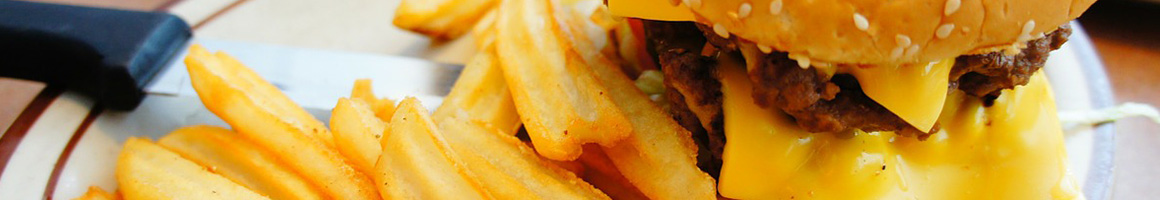 Eating Burger Sandwich at Phila Burger Station restaurant in Richmond, CA.